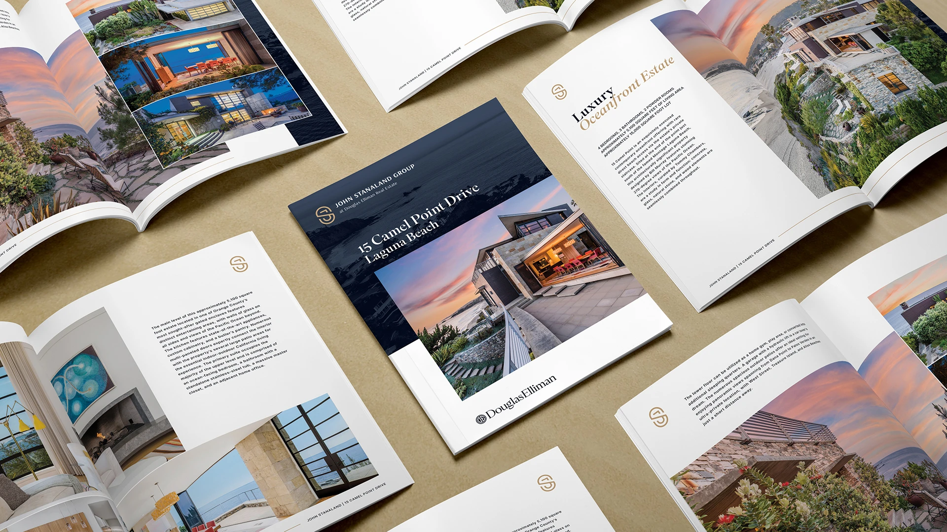 A matrix displaying the cover and interior spreads for a property brochure with John Stanaland Group branding.