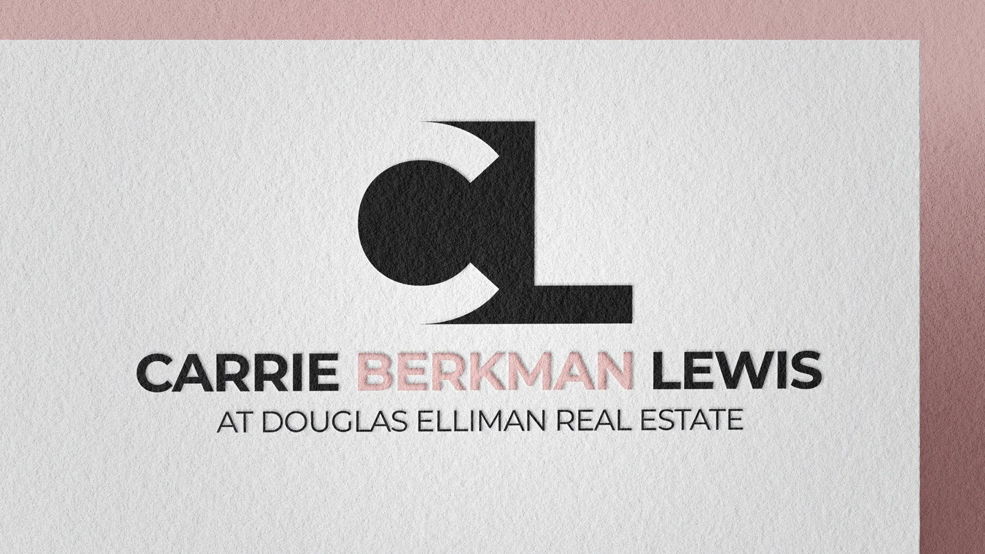 Mockup of Carrie Berkman Lewis's Brand Identity Logo as an embossed mark on textured paper